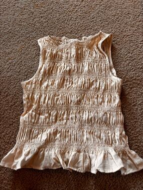 Smocked Sleeveless Ruffle Hem Top in Cream